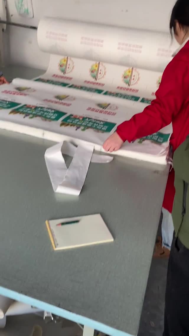 quality control inspection of custom printed canvas tote bags before bulk shipment